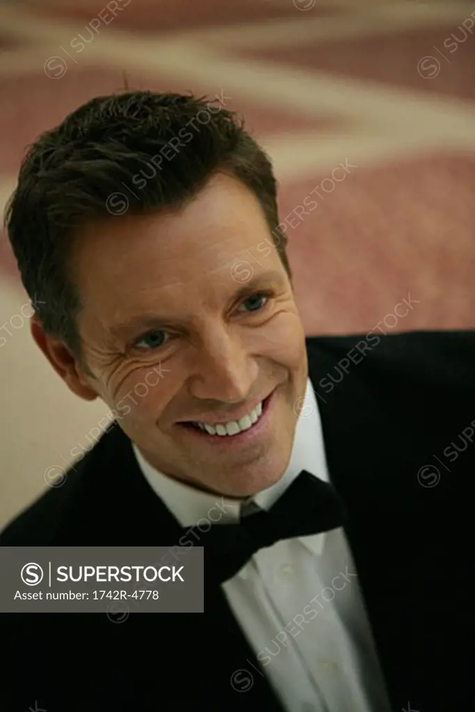 Mature man smiling wearing a bow tie