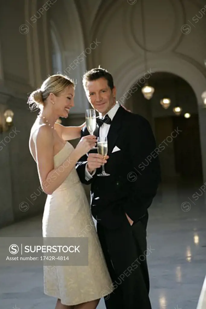 Mature couple drining champagne