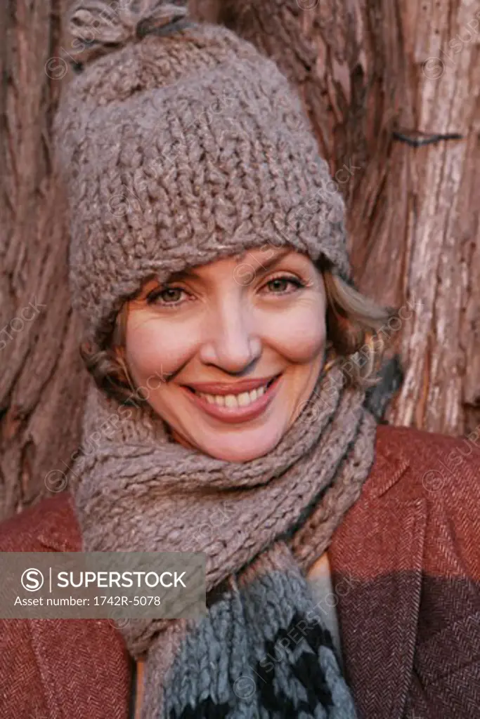 Mature woman wearing a hat and scarf