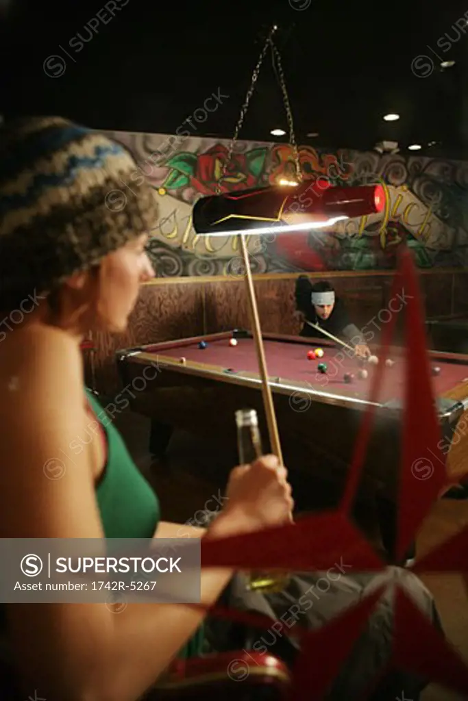 Couple in a pool hall