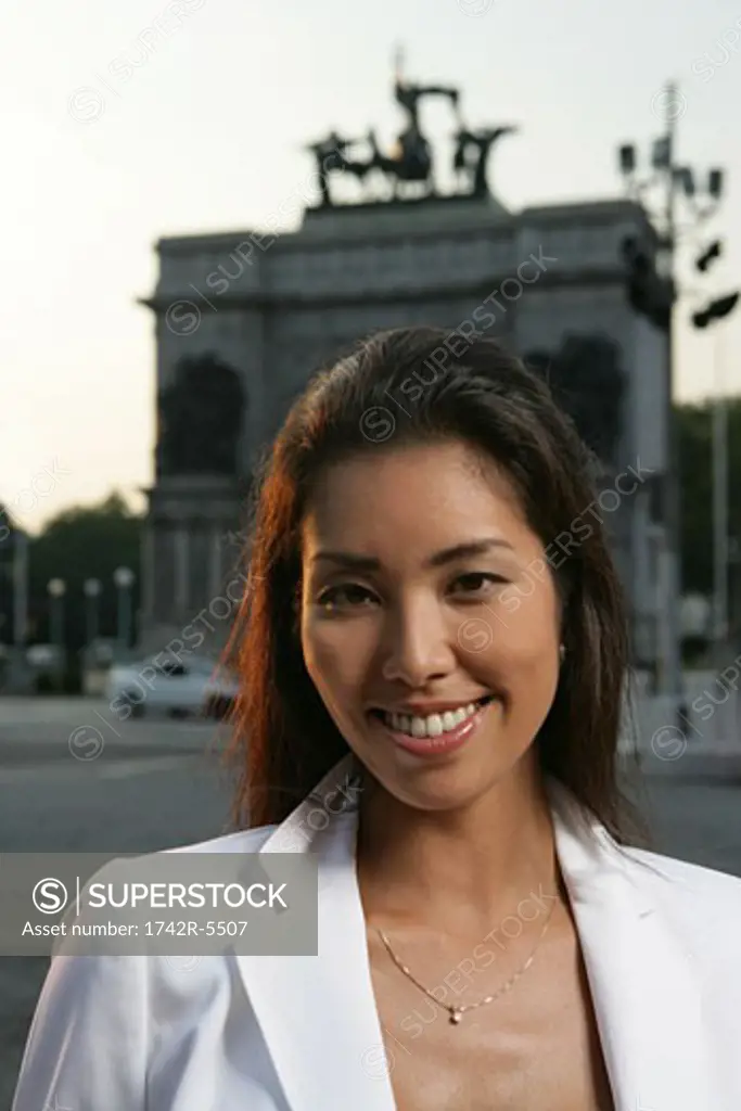 Portrait of an Asian woman smiling outdoors