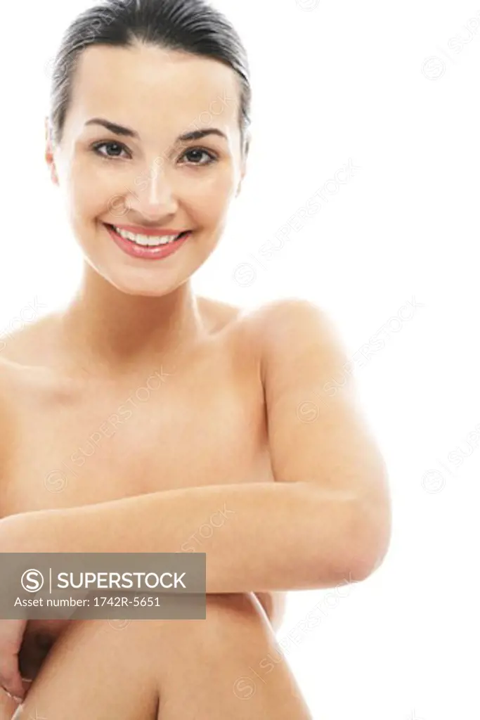 Nude woman smiling at camera