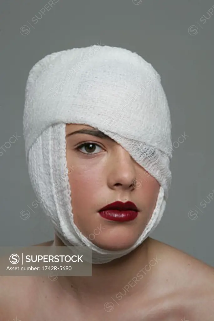 Woman with her head bandaged
