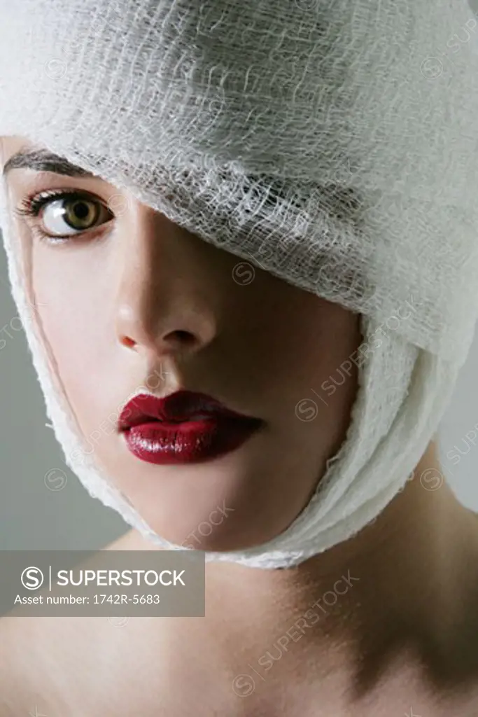 Close-up of a woman with her head bandaged