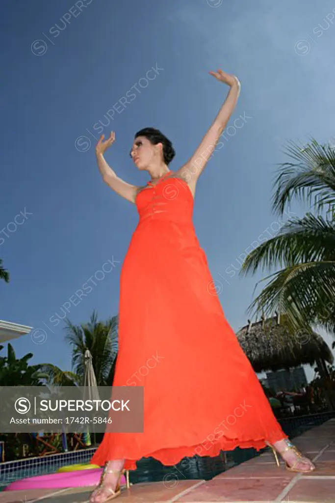 Woman posing outdoors wearing a fashionable sundress
