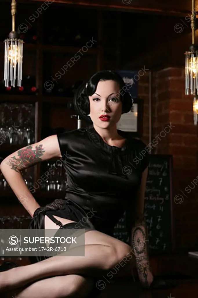 Young sexy woman in burlesque bar.