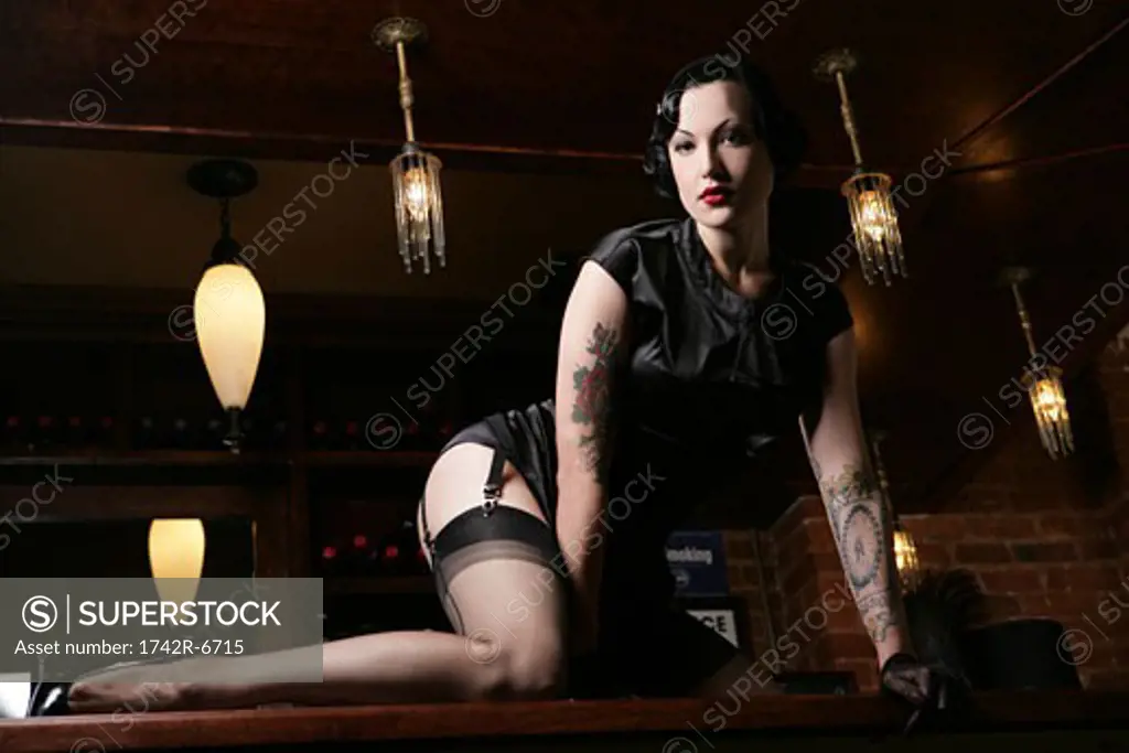 Young sexy woman in burlesque bar.