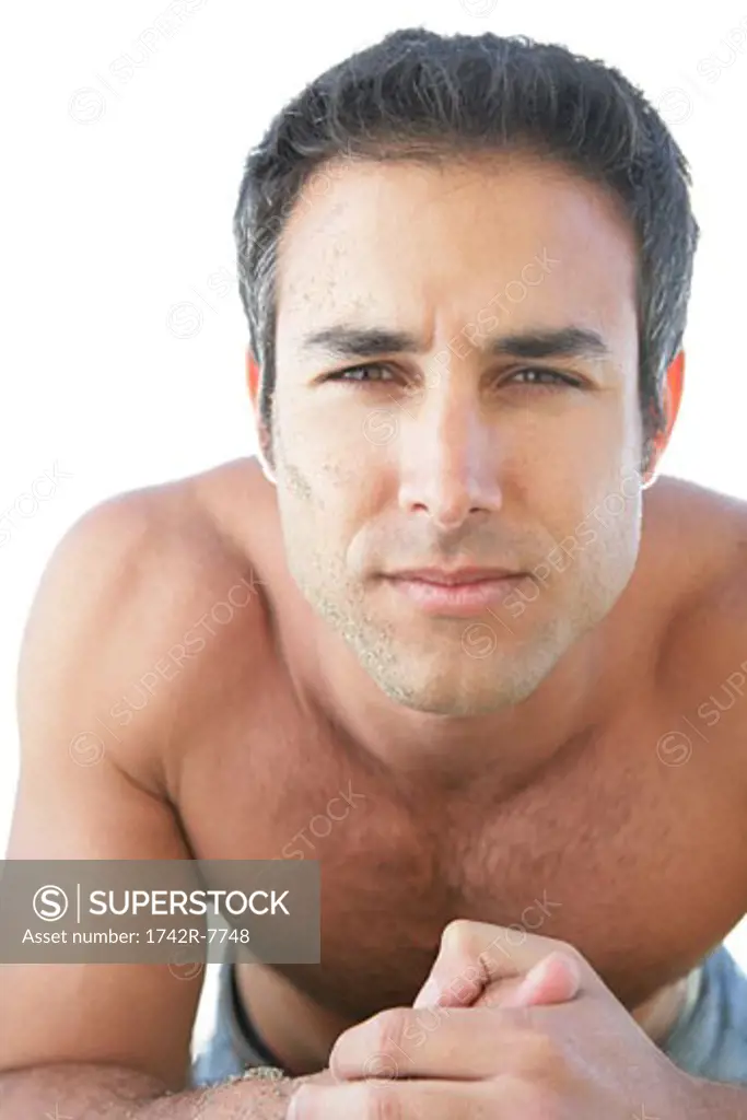 Portrait of young bare-chested man. 