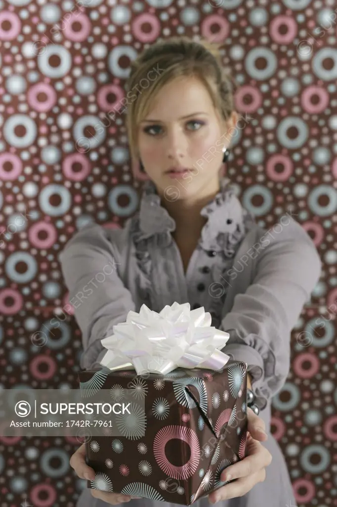 Young woman holding present.
