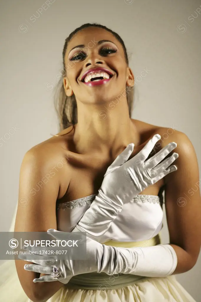 Young happy African American woman in elegant gown.