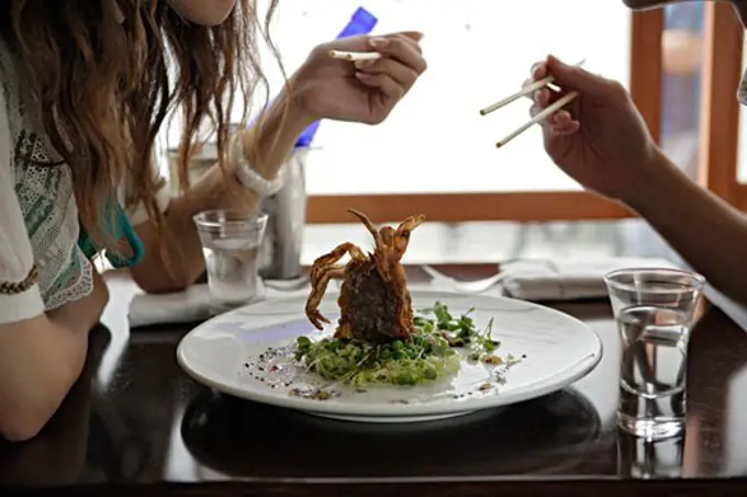 Young couple eating, close-up