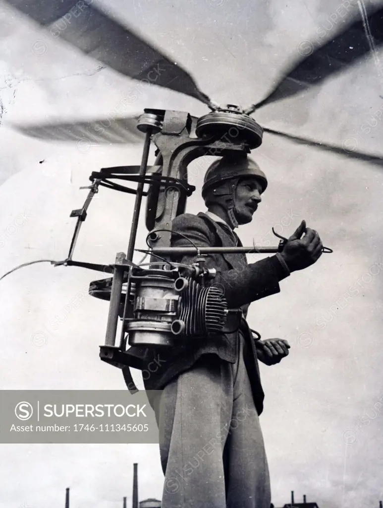 Photograph of Georges Sablier demonstrating his latest invention, a portable helicopter for which he won a special award at the international helicopter competition and show at Saint Etienne, Central France. Dated 20th Century
