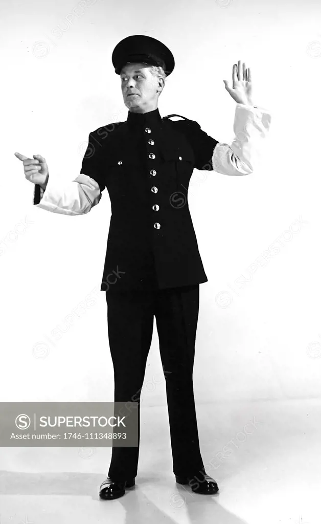 Police uniform produced from a wool/nylon blend, by H. Lottery & co. Ltd. The garment is designed for use by works police patrolmen and transport personnel. The white traffic sleeves are made entirely from continuous filament nylon. 1956