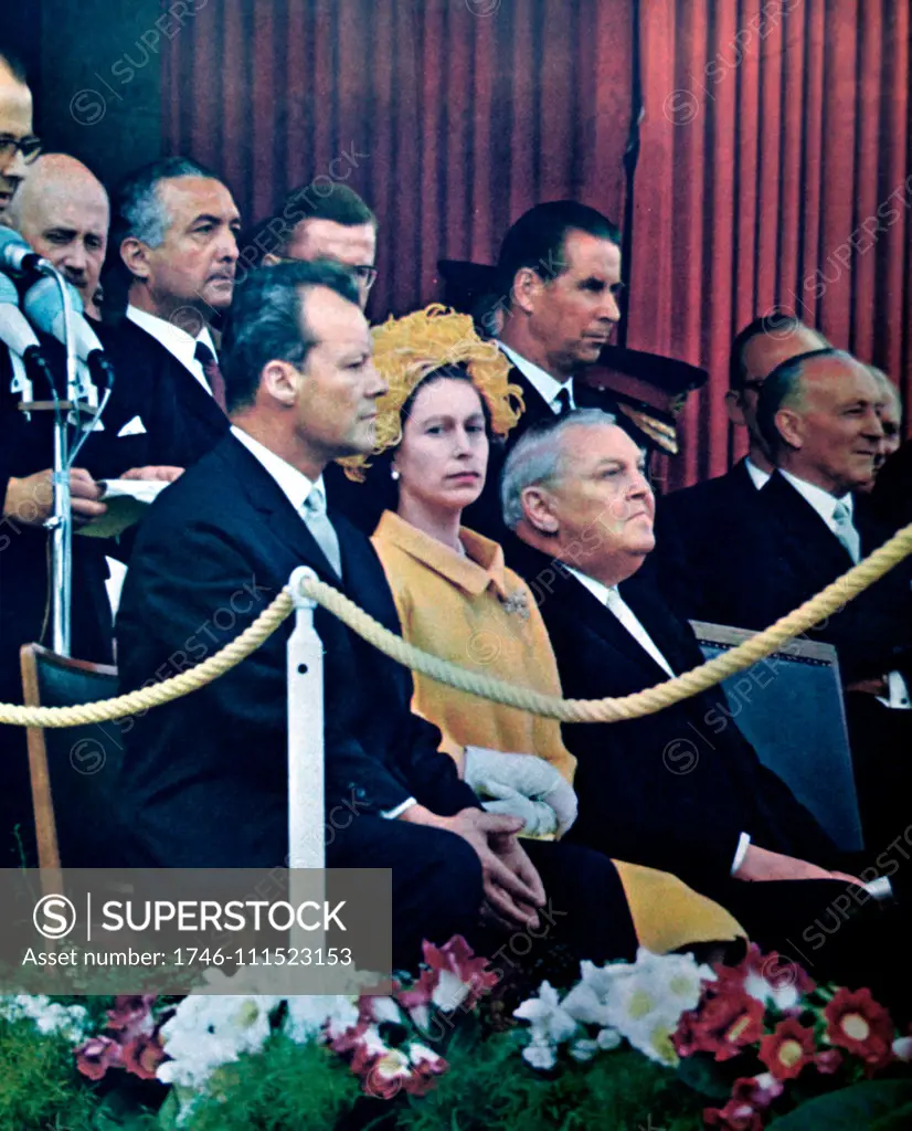 Queen Elizabeth II of Great Britain on a state visit to West Germany is accompanied by the Mayor of west Berlin, Willy Brandt and the Chancellor Ludwig Erhard
