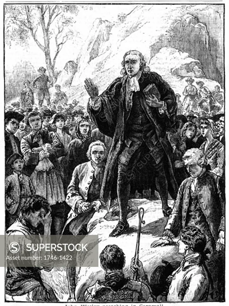 John Wesley (1703-1791) English non-conformist preacher. Founder of  Methodism. Wesley preaching in the open air Cornwall, England. Woodcut 1888.