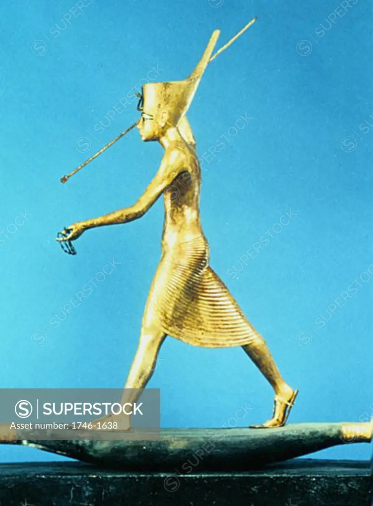 Tutankhamun (Tutenkamen) d.c.1340 BC 18th dynasty Egyptian Pharaoh. Guardian figure on his golden sarcophagus Photograph.