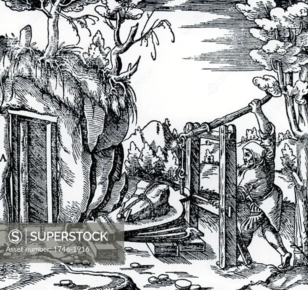 Ventilating a mine using bellows. From De re metallica, by Agricola, pseudonym of Georg Bauer (Basle, 1556).  Woodcut