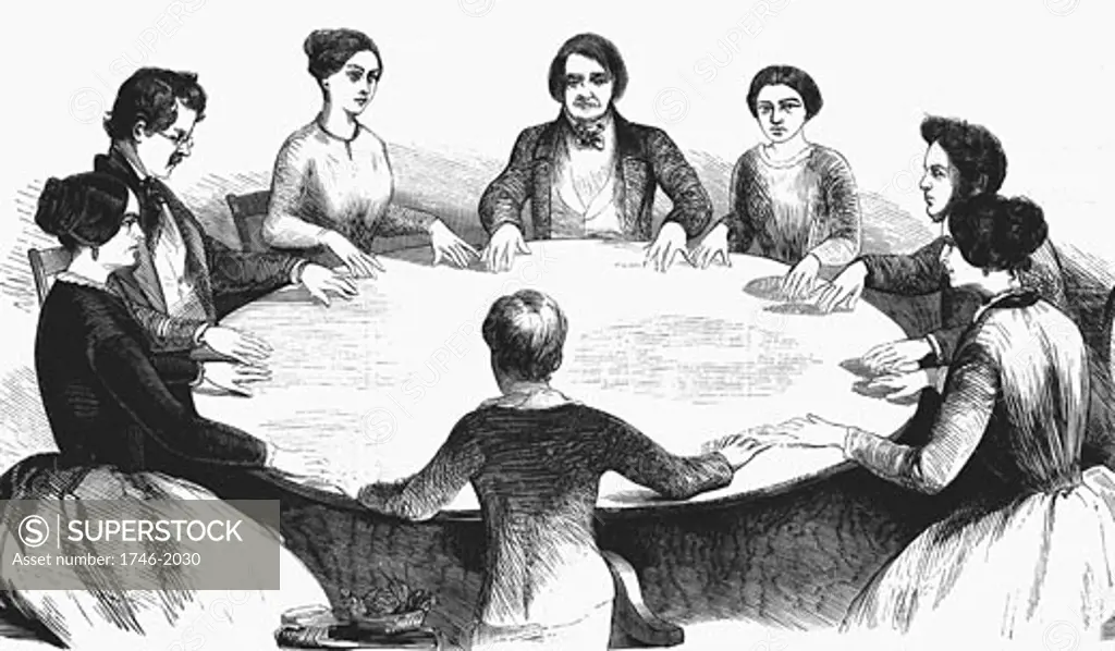 Spiritualist meeting in Leipzig. Communicating with spirits by table-turning. From  L'Illustration (Paris 1853). Wood engraving.