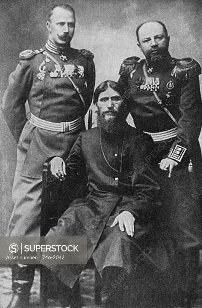 Grigori Yefimovich Rasputin, Russian monk and mystic seated between Colonel Loma (left) and Prince Putianin