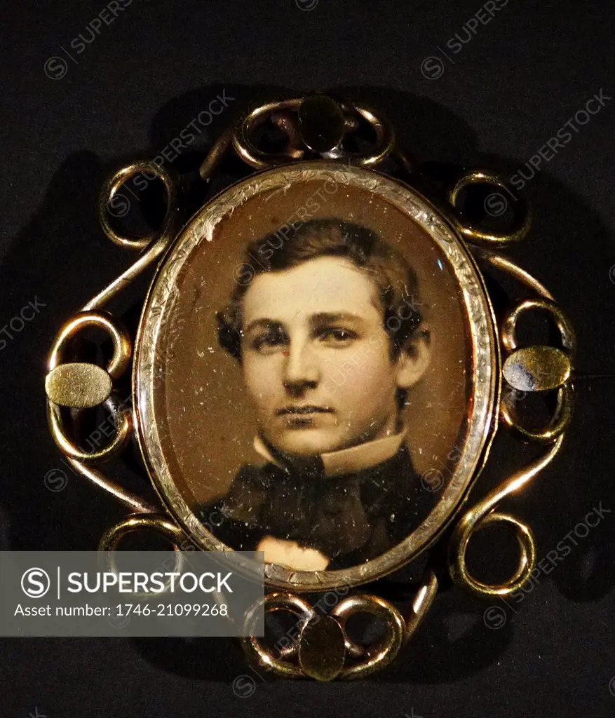 Portrait of a young man in a brooch. Dated 1859