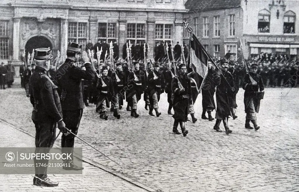 Photograph of King Albert I of Belgium reviewing French troops during World War One. Dated 1914