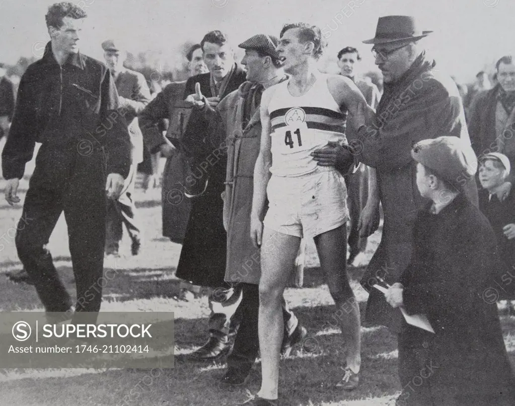 Roger Bannister (b1929) exhausted after his record-breaking run.