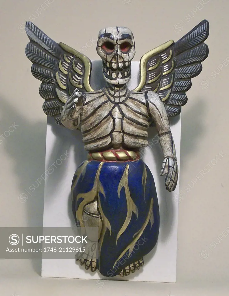 Wood carving of a winged skeleton, a figure made for the celebrations in Mexico of the Day of the Dead, or Dia de Muertos.