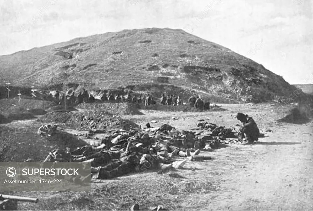 203 Metre Hill on the day of its capture by the Japanese. Russian soldiers collecting cartridges from the dead before burial, Port Arthur, Manchuria, November 1904, Russo-Japanese War, 1904