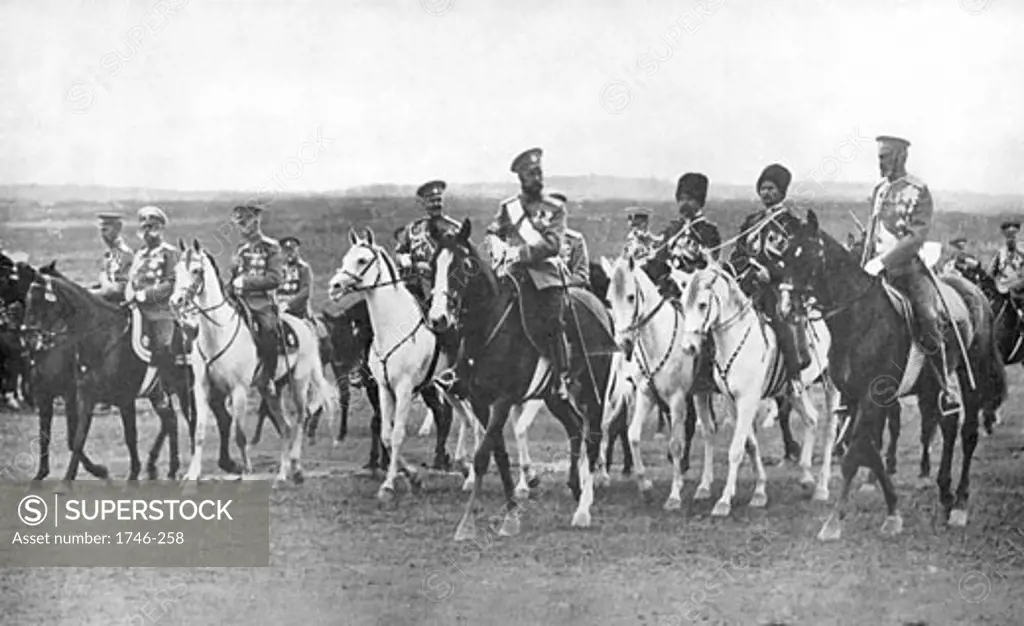 Nicholas II, (1868-1919), Tsar of Russia, on horseback accompanied by his staff officers