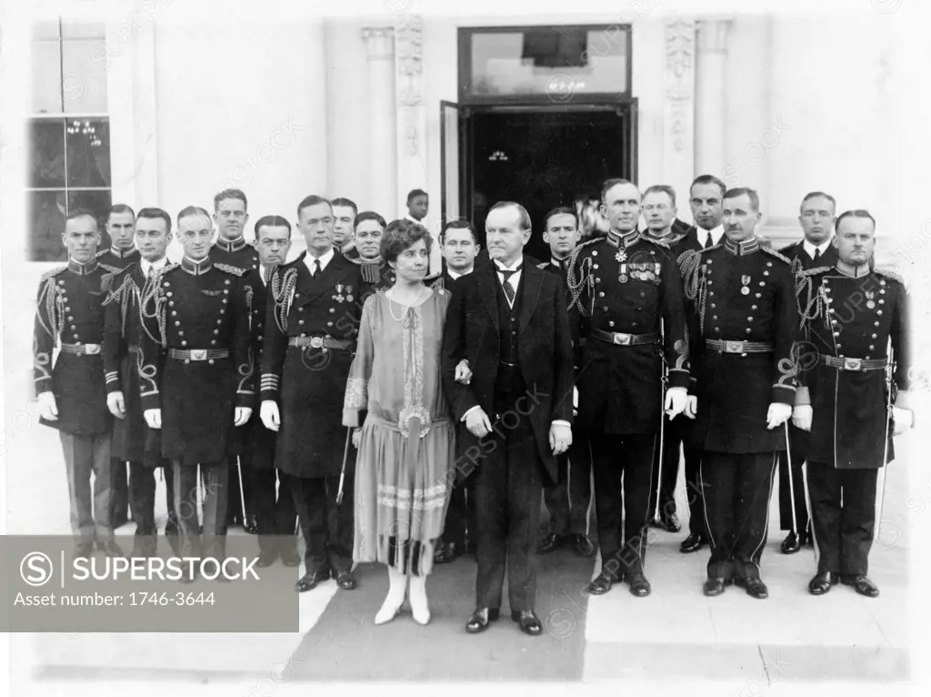John Calvin Coolidge (1872-1933) 30th President of the USA 1923-1929. President and Mrs Coolidge with military aides outside the White House on l January 1927 after a New Year reception. Republican America