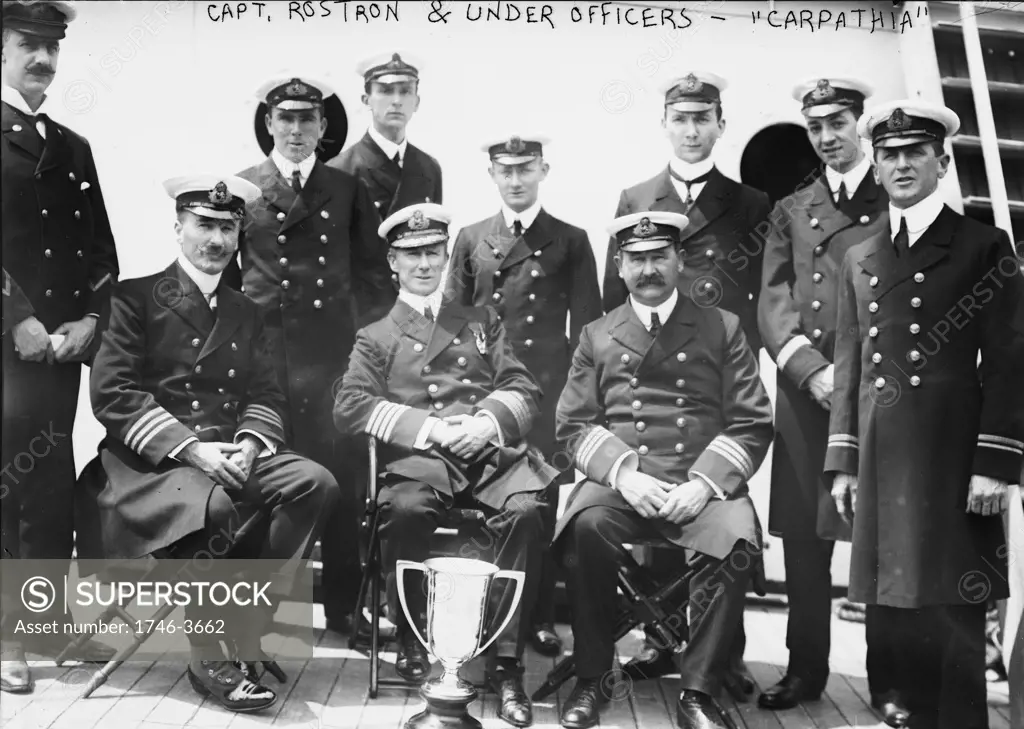 Captain Arthur Rostron and under officers of RMS Carpathia (Cunard), with loving cup presented to him by survivors of wreck of RMS Titanic (White Star Line),  12 April 1912 in recognition of  his heroism in the rescue. Shipwreck Disaster