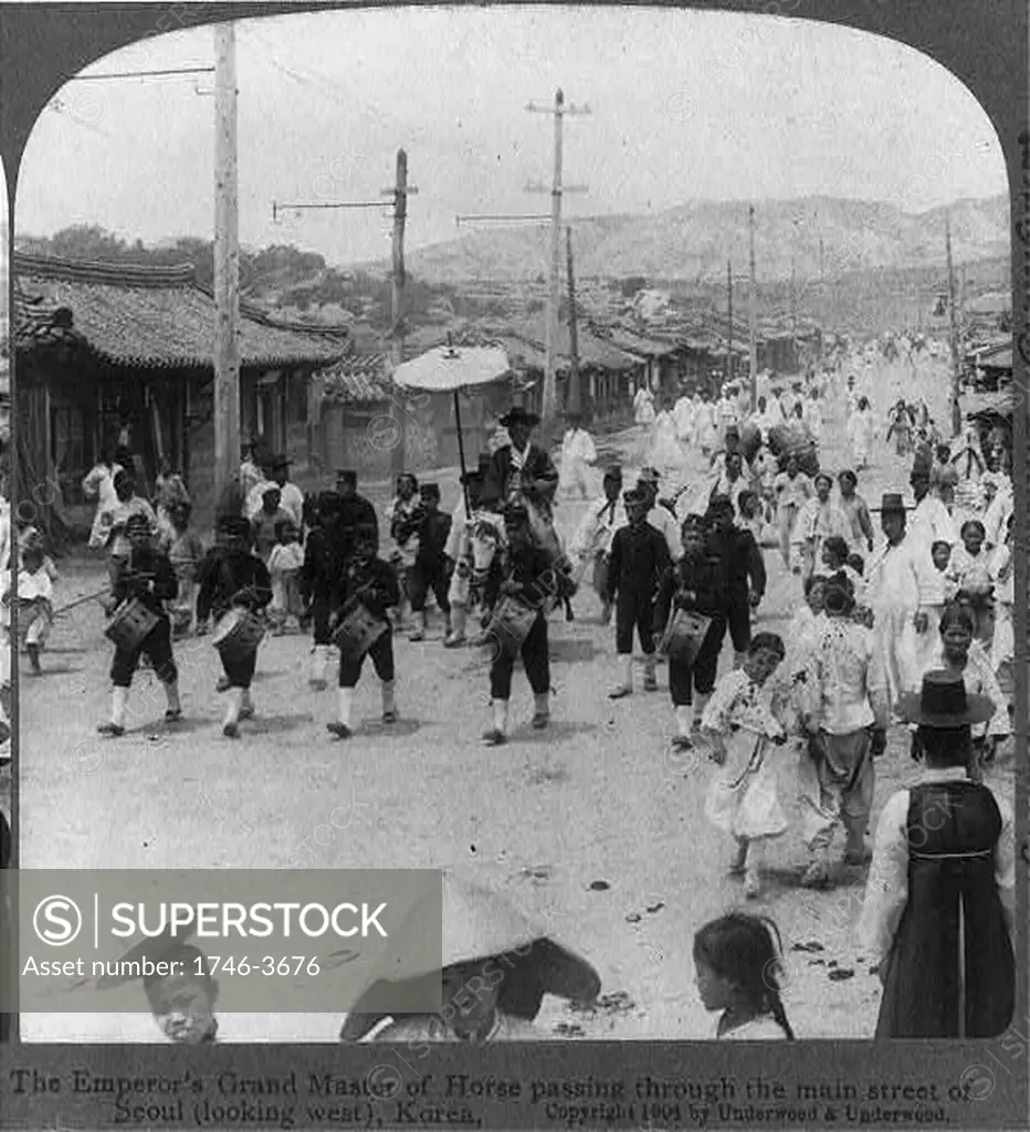 The Emperor's Grand Master of Horse passing through the main street of Seoul (looking west), Korea, 1904.   One of a pair of stereoscope cards.