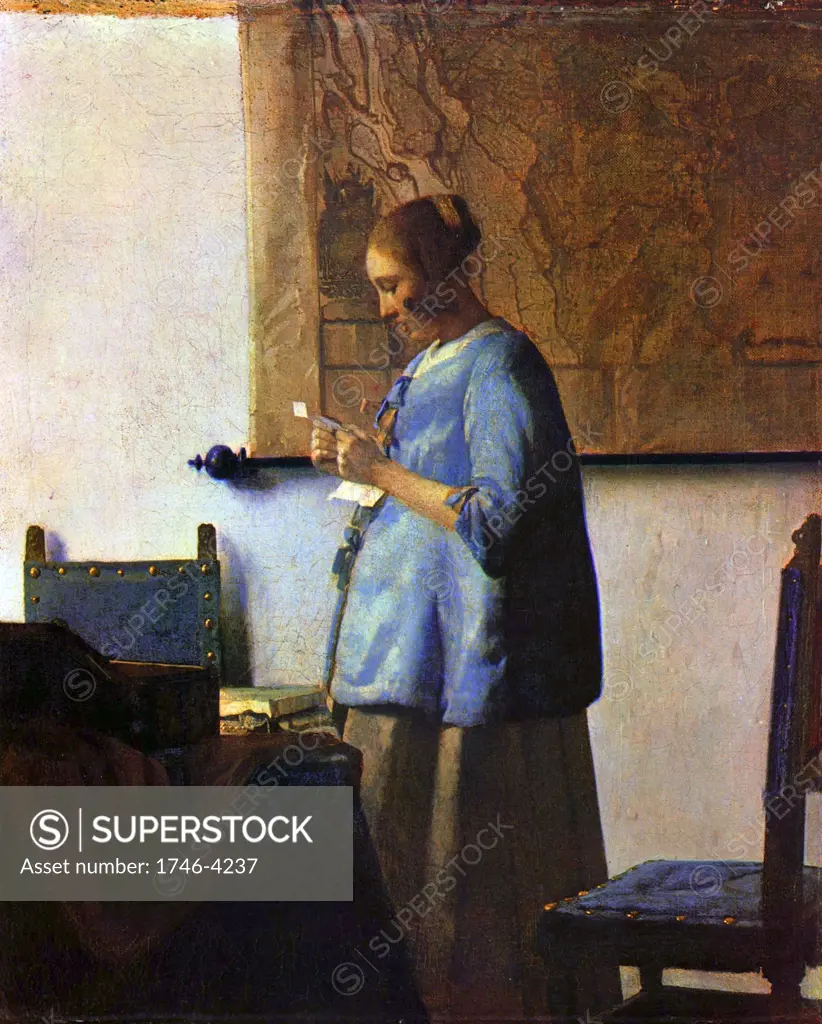 Johannes Vermeer (1632    1675 ) Dutch artist. 'Woman reading a letter'  or  'Woman in Blue Reading a Letter'. ca. 1662-1663