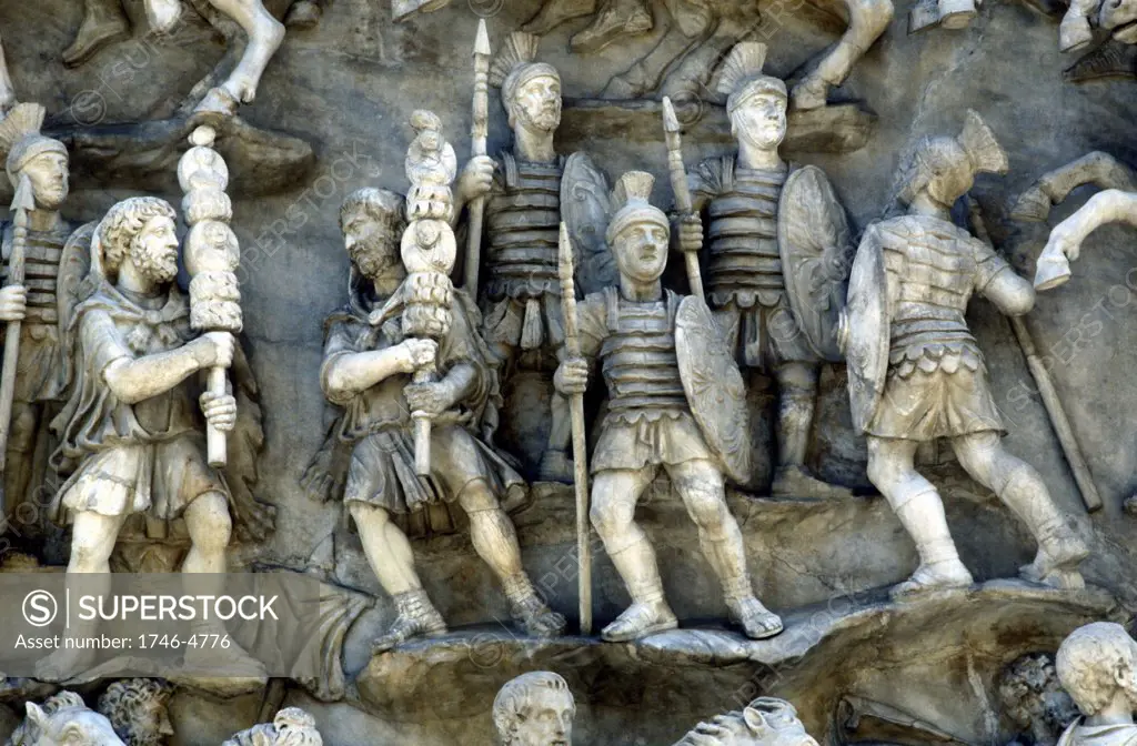 Roman soldiers taking part in Decursio - ritual circling of funeral pyre. Detail of relief from the Antonine Column, Rome erected c180-196  by Commodus in honour of his father and predecessor as Roman emperor, Marcus Aurelius (121-180) and commemorating his defeat of the German tribe the Marcomanni or Marcomani (167-168).