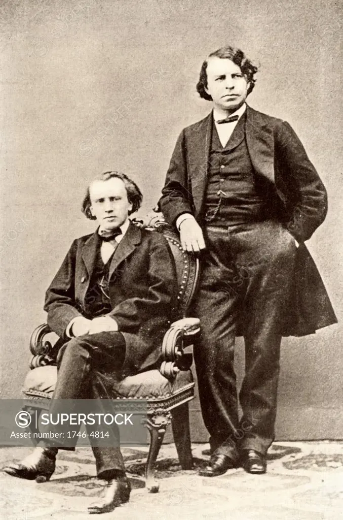Johannes Brahms (1833-1897) German composer, seated, with  Joseph Joachim (1831-1907) Hungarian violinist and composer and director of the Berlin Conservatory.   Halftone from a photograph.