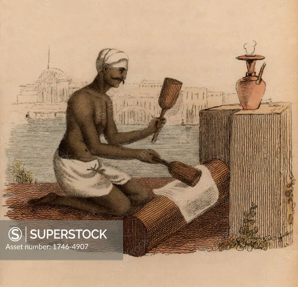 Beating cotton cloth with wooden mallets to give it greater strength: India.  Hand-coloured engraving published Rudolph Ackermann, London, 1822.