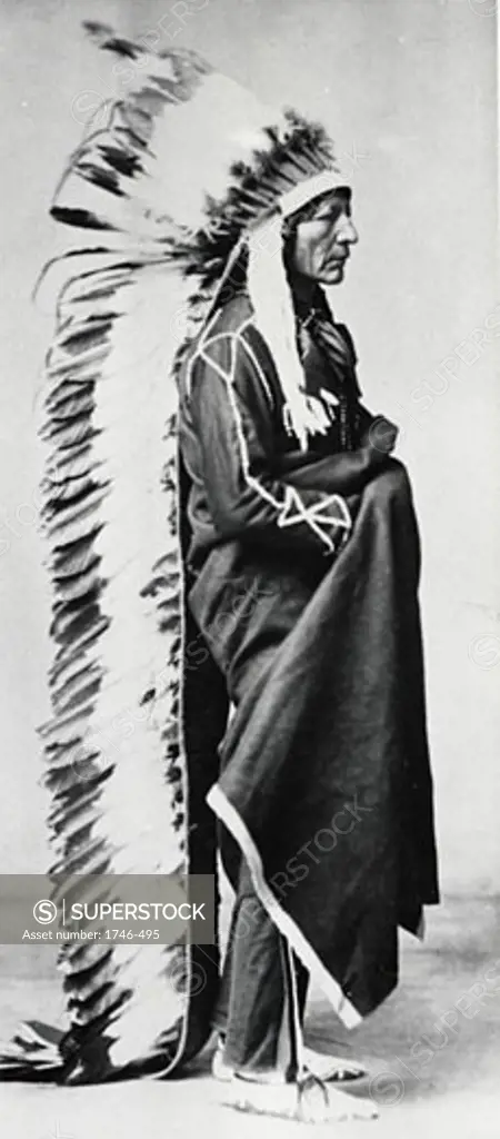 Standing Bear, Chief of the Sioux, wearing ceremonial robes and full length head-dress of eagle feathers, Dakota, North American Plains Indians Photograph c. 1885-1890