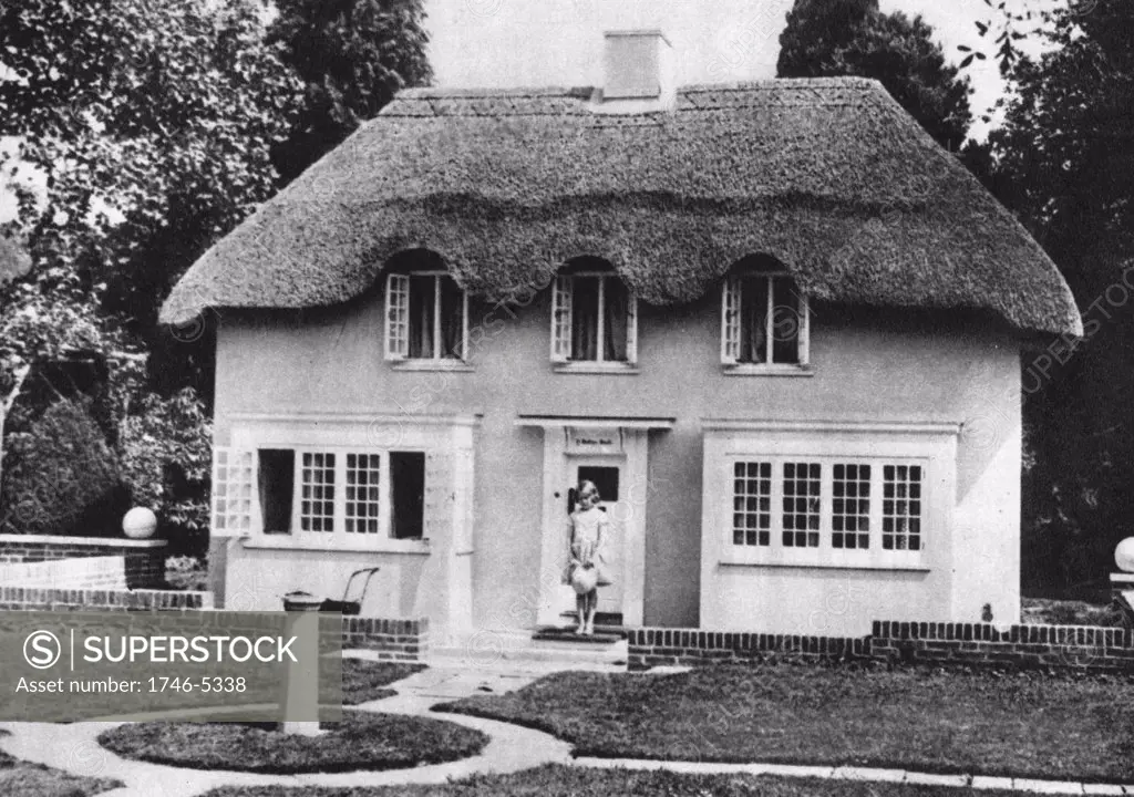 Princess Elizabeth (Elizabeth II of Great Britain from 1952) as a child on the steps of Y Bwthn Bach (The Little House) the play house given by the people of Wales