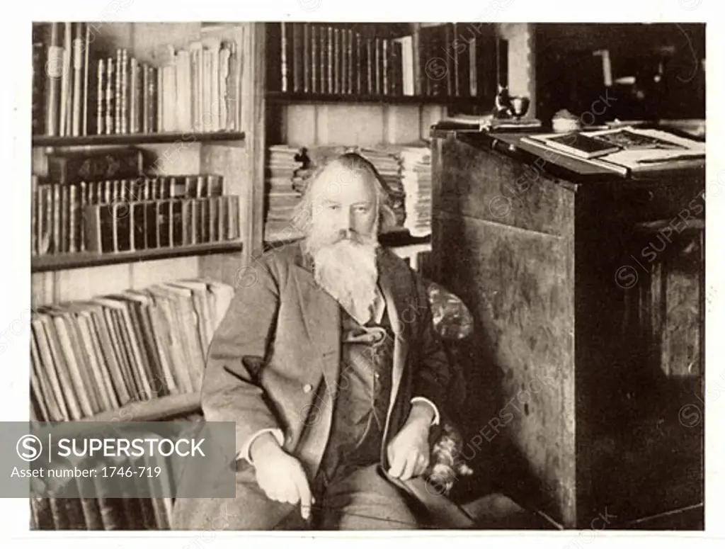 Johannes Brahms, (1833-1897), German composer in his library. Halftone from a photograph