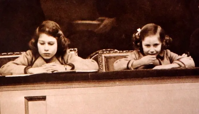 On March 3rd, Princess Elizabeth (later Queen Elizabeth II of Great Britain), and Princess Margaret attended the National Pony Show at the Royal Agricultural Hall. They are seen in this picture watching the children's competitions, Princess Margaret obviously very thrilled.