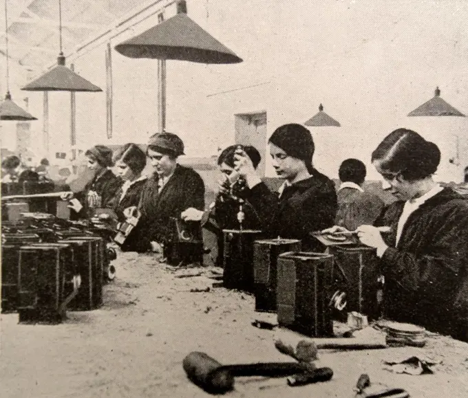 Women doing war work. Assembling naval signal lamps; England during world war one 1916