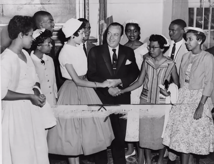 New York City Mayor Robert Wagner greeting the teenagers who integrated Central High School, Little Rock, Arkansas. Pictured, front row, left to right: Minnijean Brown, Elizabeth Eckford, Carlotta Walls, Mayor Wagner, Thelma Mothershed, Gloria Ray, back row, left to right: Terrance Roberts, Ernest Green, Melba Pattilo, Jefferson Thomas.