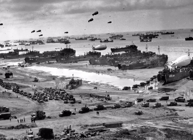 Photograph of D-Day landing craft, boats and seagoing vessels used to convey a landing force (infantry and vehicles) from the sea to the shore during an amphibious assault. Dated 1944