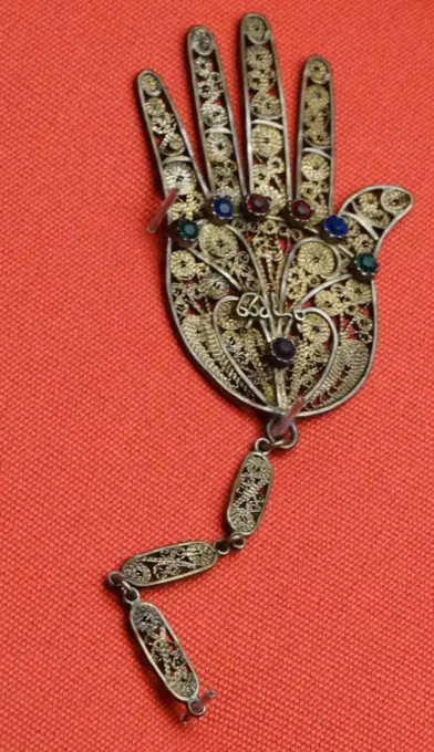 Amulet from a collection of Algerian, Italian and Tunisian amulets. Amulets such as this would have been kept in the home or worn on the body in order to provide protection against evil spirits or in order to help cure ill health.