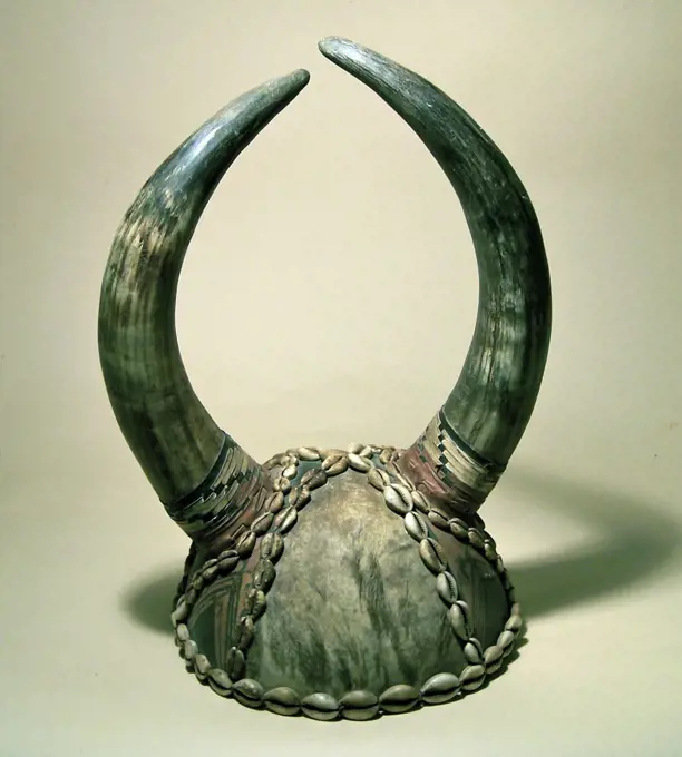 Nigerian horned helmet, decorated with cowrie shells.