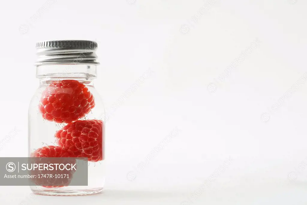 Rasberries in small jar