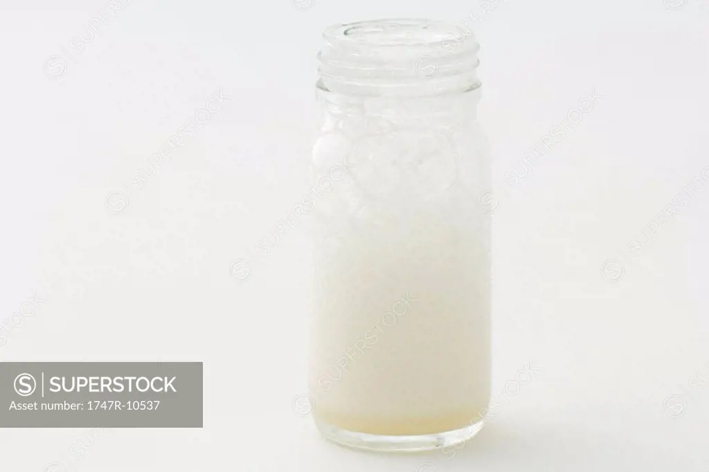 Glass jar with soap suds