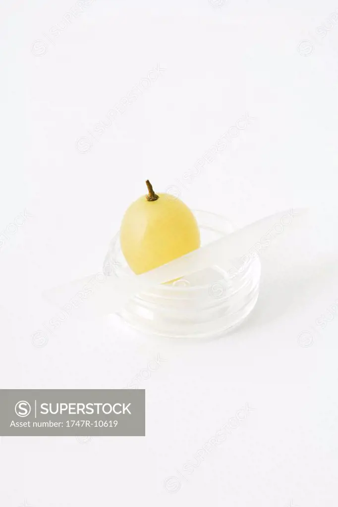 White grape in small plastic container, close-up