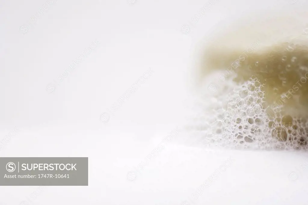 Bar of soap and suds, close-up