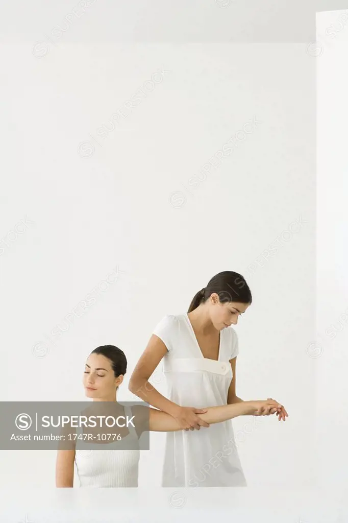 Woman receiving arm massage
